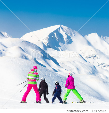 Family on ski vacations. 13472464