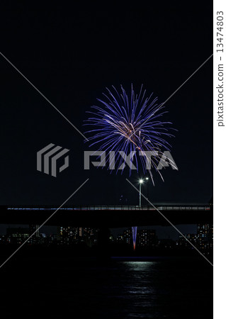 Fireworks and landscape reflected on the river 13474803