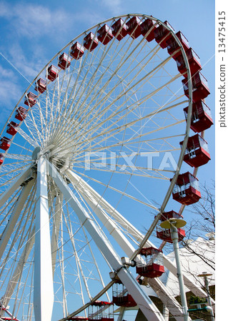 Large Ferris wheel in blue sky background 13475415