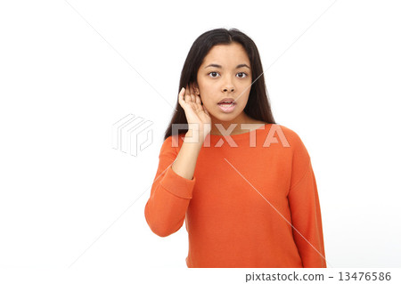 Asian woman listening 13476586