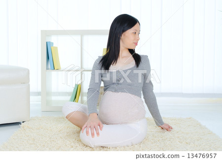 Pregnant woman exercise at home Pregnant woman exercise at home 13476957