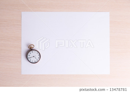 classic clock on a white sheet of paper classic clock on a white sheet of paper 13478781