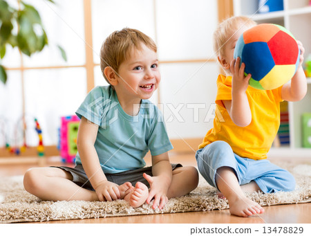 Stock Photo: children play with ball indoor