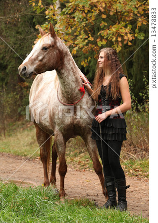 Amazing girl standing next to the appaloosa horse Amazing girl standing next to the appaloosa horse 13478833