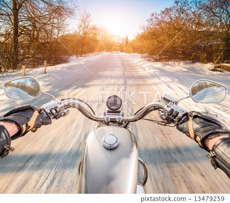 Biker First-person view. Winter slippery road 13479259