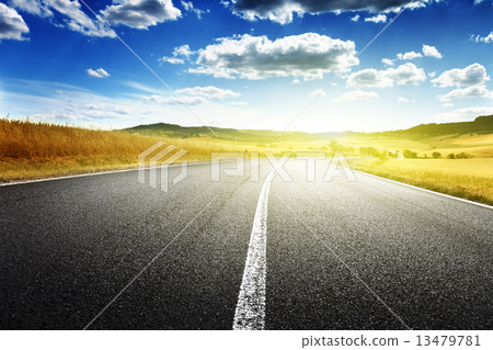 asphalt road in Tuscany, Italy 13479781