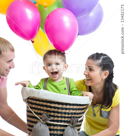 family playing with son in flight on a makeshift balloon  13482173