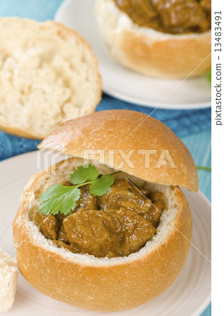 Bunny Chow - South African mutton curry inside a bread bun Bunny Chow - South African mutton curry inside a bread bun 13483491