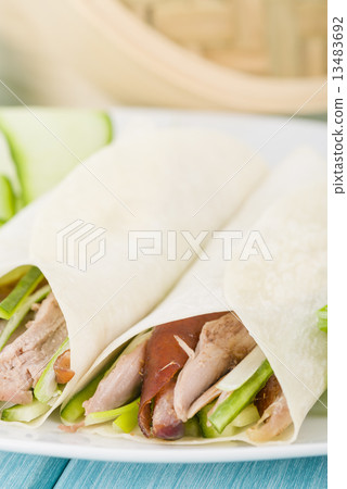 Peking Duck Wraps - Chinese roast duck wrapped in pancakes.  13483692