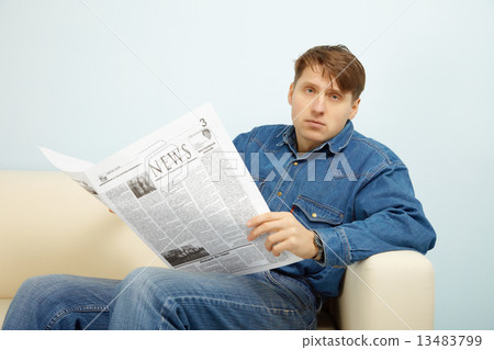 Man disappointed with news from newspaper 13483799