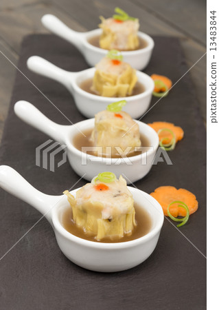 Chinese pork dumplings (shumai) with hot & sour soup.  13483844