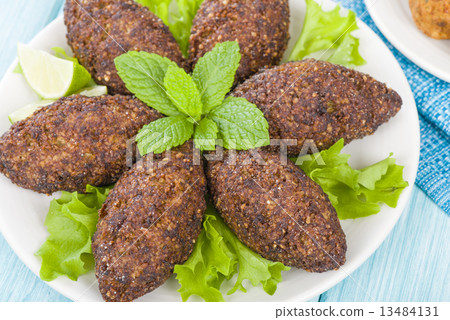 Kibbeh - Middle Eastern minced meat and bulghur fried snack  13484131