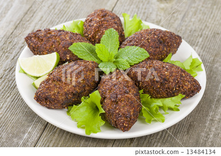 Kibbeh - Middle Eastern minced meat and bulghur fried snack  13484134