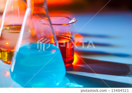 Backlit laboratory flask. 13484521