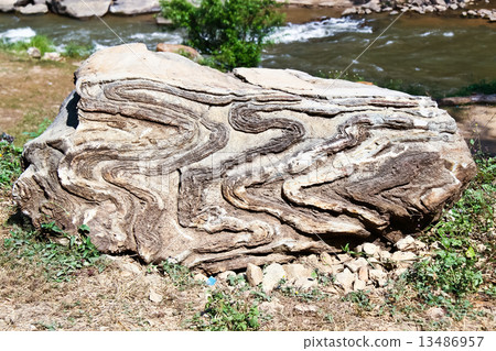 folding in geological  inside one rock near the river 13486957