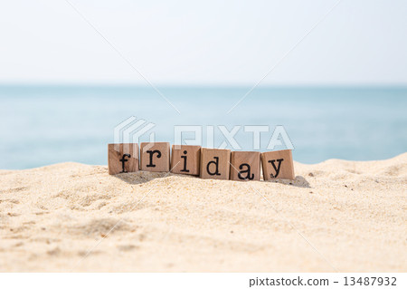 Friday word on sea sand beach 13487932