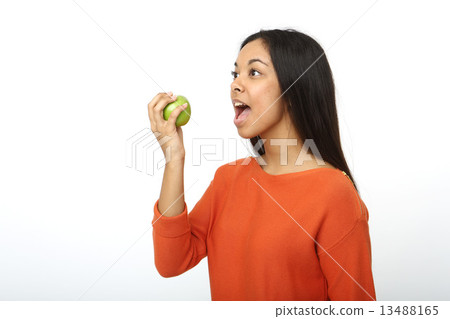 Asian woman gnawing apple 13488165