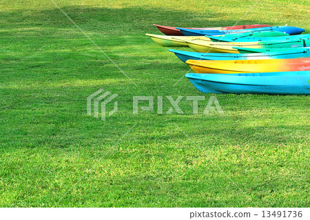Canoeing the many colorful arranged on the lawn. From water to dry 13491736