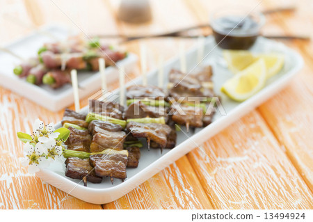 Kushiyaki - Butabara (belly pork) and Asuparabekon (asparagus wrapped in bacon). Japanese grilled fo 13494924