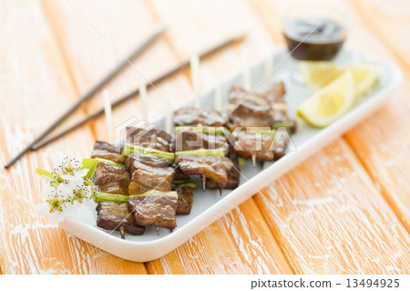 Kushiyaki - Butabara (belly pork) and Asuparabekon (asparagus wrapped in bacon). Japanese grilled fo Kushiyaki - Butabara (belly pork) and Asuparabekon (asparagus wrapped in bacon). Japanese grilled fo 13494925