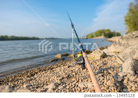 Modern clean fishing rod outdoors Modern clean fishing rod outdoors 13495128