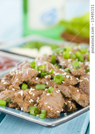 Bulgogi - Korean grilled marinated beef served with green chillies, garlic and kimchi . 13495151