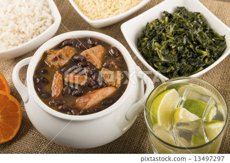 Feijoada - Brazilian meat & bean stew, side dishes & caipirinha  13497297