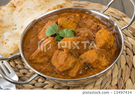 Goan Pork Vindaloo - Indian pork curry with naan bread  13497434