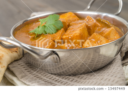Paneer Butter Masala - Indian curd cheese curry in a balti dish.  13497449