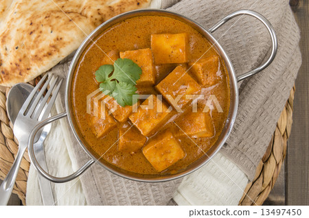 Paneer Butter Masala - Indian curd cheese curry in a balti dish.  13497450