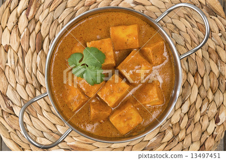 Paneer Butter Masala - Indian curd cheese curry in a balti dish. Paneer Butter Masala - Indian curd cheese curry in a balti dish. 13497451