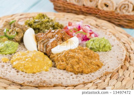 Ethiopian Feast - Injera (sourdough flatbread) with stews  13497472