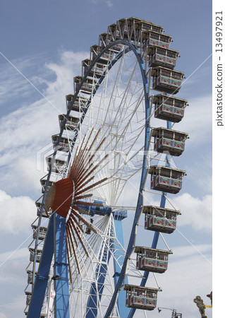 The high ferry wheel at the Oktoberfest in Munich The high ferry wheel at the Oktoberfest in Munich 13497921