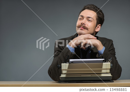 Inspired young author typing Inspired young author typing 13498881