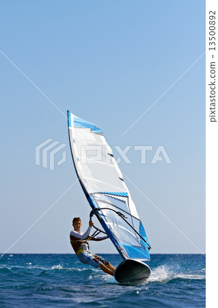 Fast approaching windsurfer 13500892
