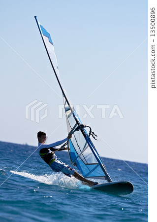 Side view of young windsurfer 13500896