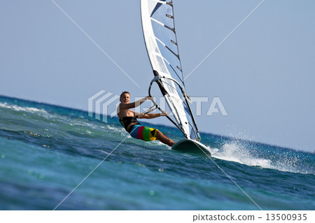 Fast approaching windsurfer 13500935