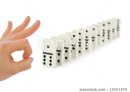 Hand and domino Hand and domino 13501979