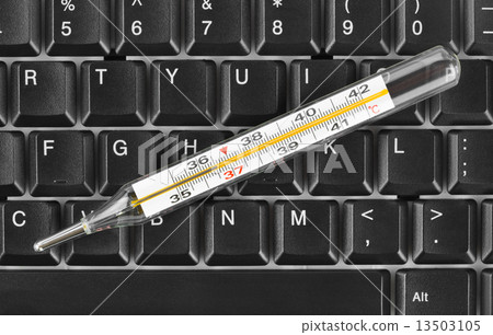 Thermometer on computer keyboard 13503105