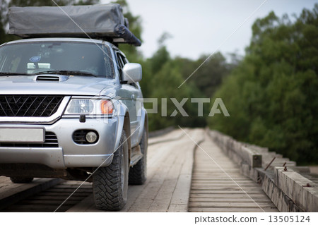 4x4 car on wooden bridge 13505124