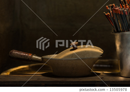 Dirty and dust baked pot with chopsticks for chinese style.  Sti 13505978