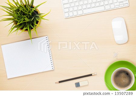 Office table with notepad, computer, coffee cup and flower Office table with notepad, computer, coffee cup and flower 13507289