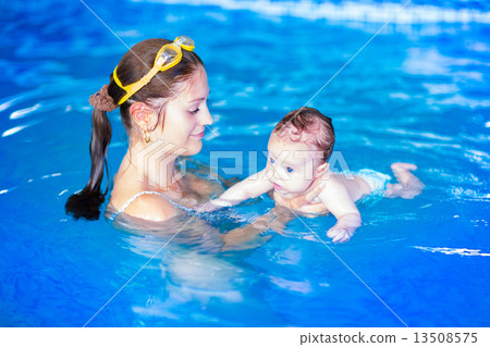 Mother and baby in swimming pool 13508575