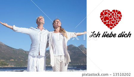 Composite image of happy couple standing with arms outstretched Composite image of happy couple standing with arms outstretched 13510202