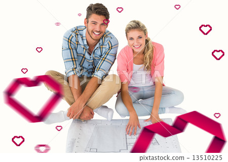 Composite image of attractive young couple sitting looking at bl 13510225