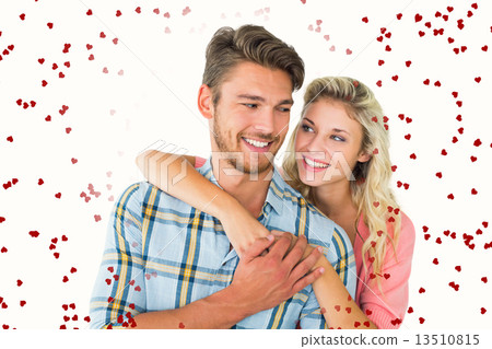 Composite image of attractive couple embracing and smiling Composite image of attractive couple embracing and smiling 13510815