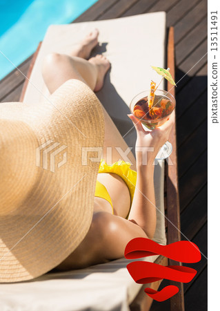 Composite image of beautiful woman holding drink by swimming poo Composite image of beautiful woman holding drink by swimming poo 13511491