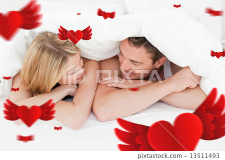 Composite image of lovely couple in their bed Composite image of lovely couple in their bed 13511493