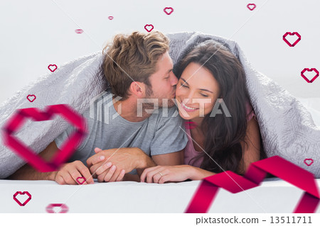 Composite image of attractive man kissing his wife 13511711