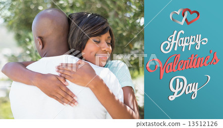 Composite image of happy couple hugging each other in garden Composite image of happy couple hugging each other in garden 13512126